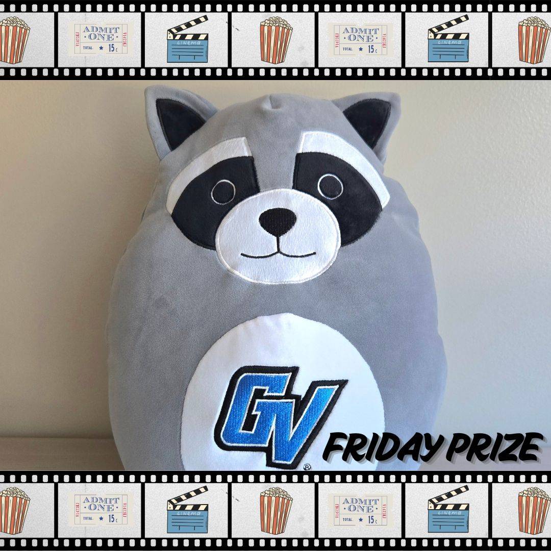 Grey raccoon stuffed animal with the GV logo on it's stomach